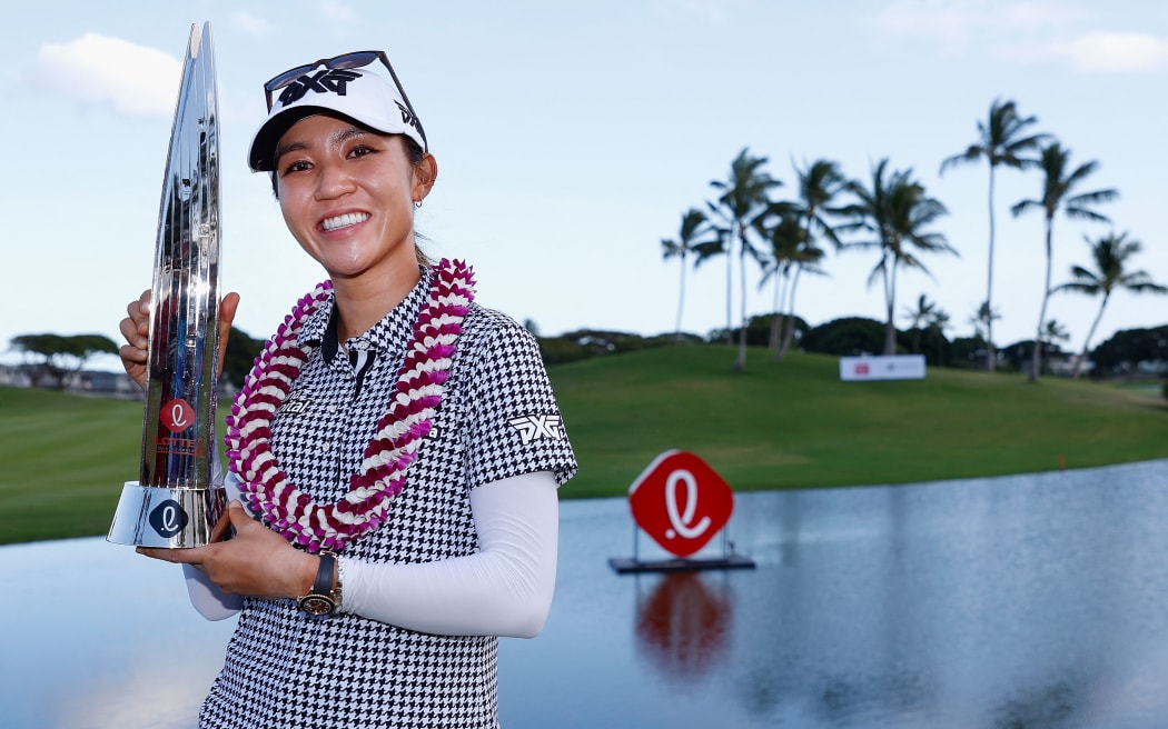 Lydia Ko poses with the trophy after winning the LPGA LOTTE Championship at Kapolei Golf Club in Hawaii.