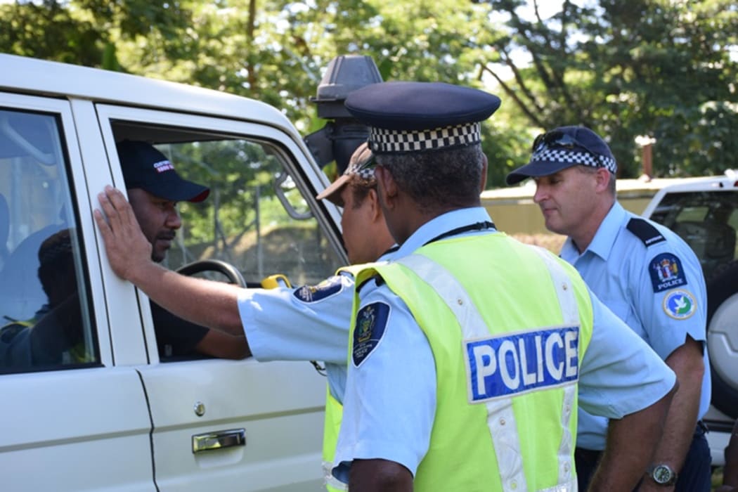Solomon Islands traffic police learning to use the new breathalyzer kits.