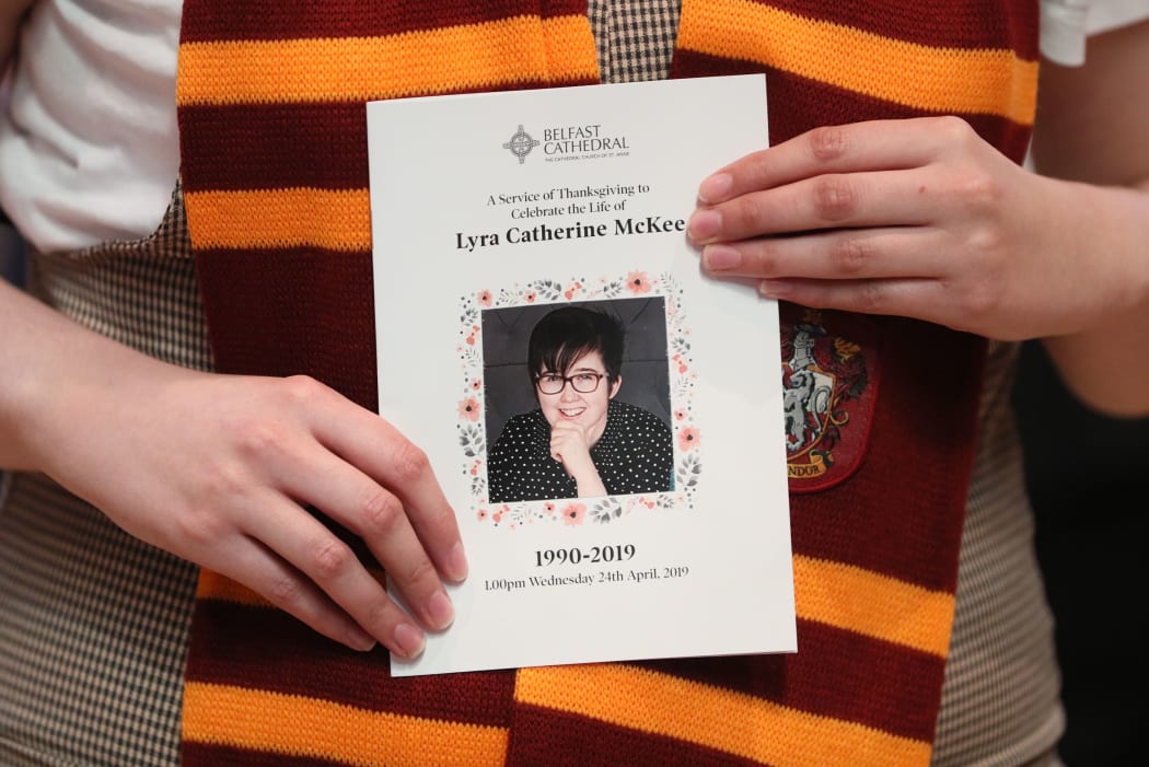 A mourner wearing a Gryffindor scarf holds an order of service as she arrives to attend the funeral service of journalist Lyra McKee (29) who was killed by a dissident republican paramilitary in Northern Ireland.