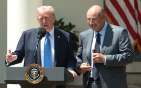 WASHINGTON, DC - MAY 01: U.S. President Donald Trump (L) speaks alongside Dr. Phil McGraw during a National Day of Prayer event in the Rose Garden at the White House on May 1, 2025 in Washington, DC. The National Day of Prayer is a congressionally recognized observance that calls on people of all faiths to participate in a day of prayer and reflection.   Alex Wong/Getty Images/AFP (Photo by ALEX WONG / GETTY IMAGES NORTH AMERICA / Getty Images via AFP)
