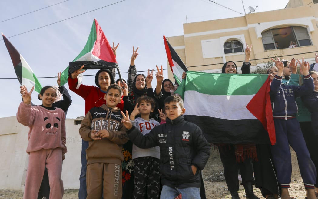 Palestinians gather to celebrate in the streets of Rafah, Gaza Strip, on January 19, 2025. They return to their homes after over a year of conflict, following a ceasefire agreement between Israel and Hamas. (Photo by Youssef Alzanoun / Middle East Images / Middle East Images via AFP)