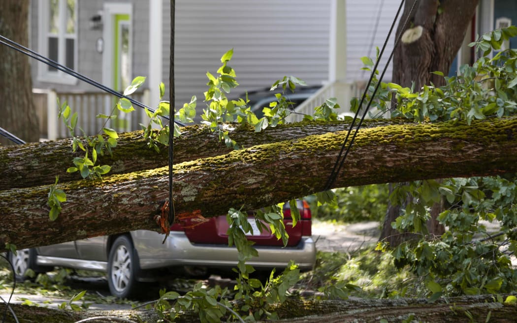 Emergency personnel clear trees from the side of the road after Hurricane Dorian passed in Dartmouth, Nova Scotia on September 8, 2019.