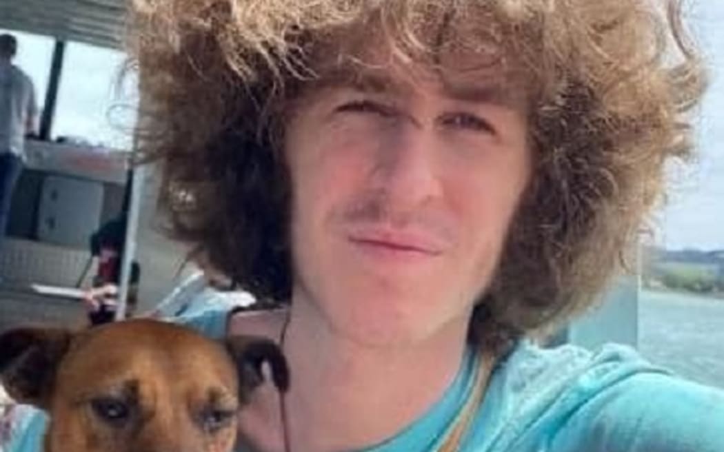 Jordan has brown bushy hair, is of a thin build and around 175cm tall.