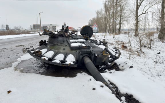A fragment of a destroyed Russian tank is seen on the roadside on the outskirts of Kharkiv on February 26, 2022, following the Russian invasion.