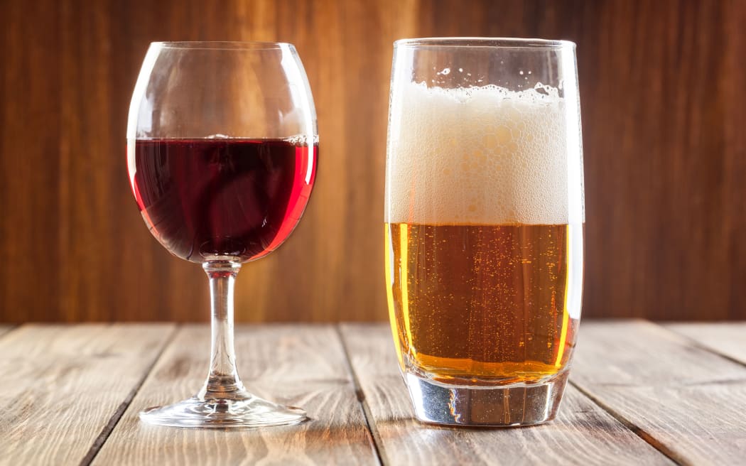 Red wine glass and glass of light beer