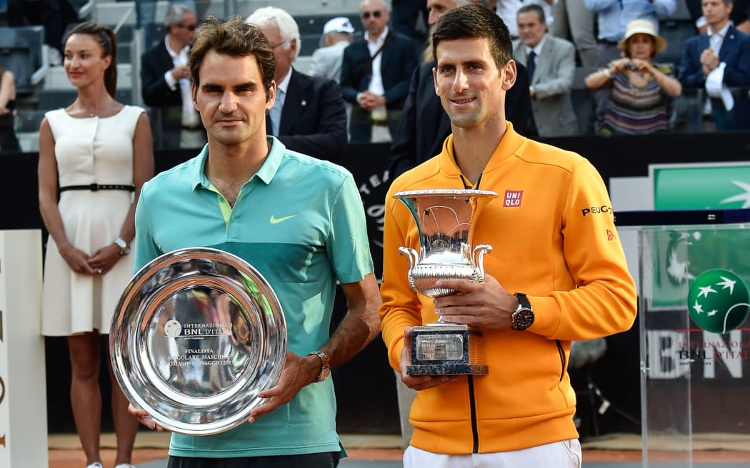 Roger Federer and Novak Djokovic pose with the Rome silverware, 2015