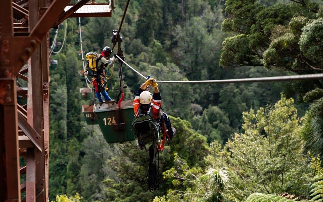 Protesters used the aerial ropeway cables as a zip line to access a coal bucket high off the ground.