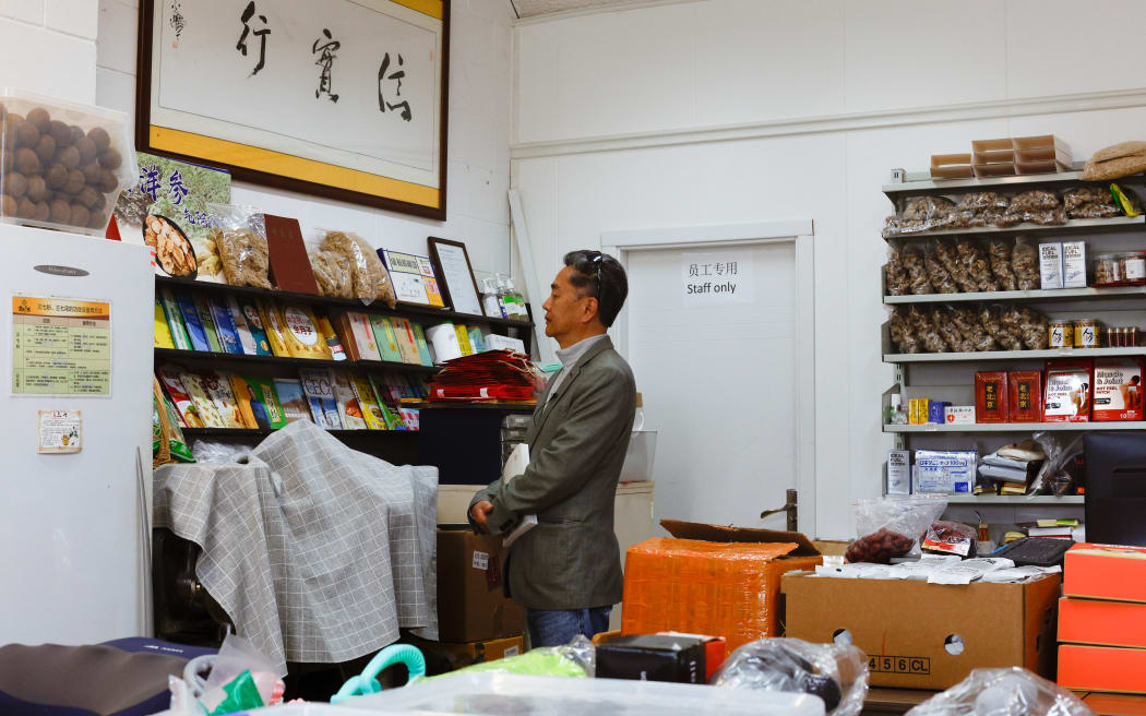 Hua Fang at the grocery store, located at the former site of his bookstore.