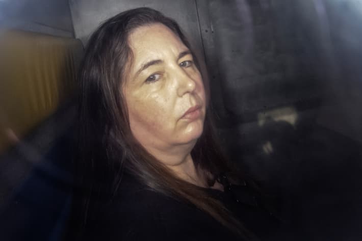 Erin Patterson arriving in the back of a prison transport vehicle at Latrobe Valley Magistrate's Court in Morwell, Australia.