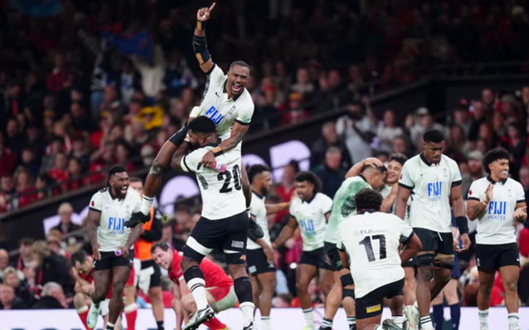 Fiji's Jiuta Wainiqolo is hoist aloft as his side celebrate their win in Cardiff. Photograph: David Davies/PA