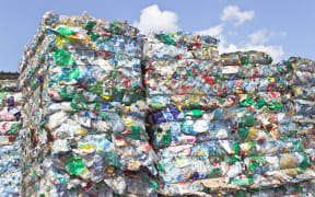 Stack of plastic bottles for recycling.