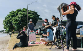 Tima Alhaddad, Lara Khayyat and Aliya Alhaddad with the entire crew filming Tima on Milford Beach.
