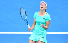 Elise Mertens celebrates winning her match at the Australian Open.