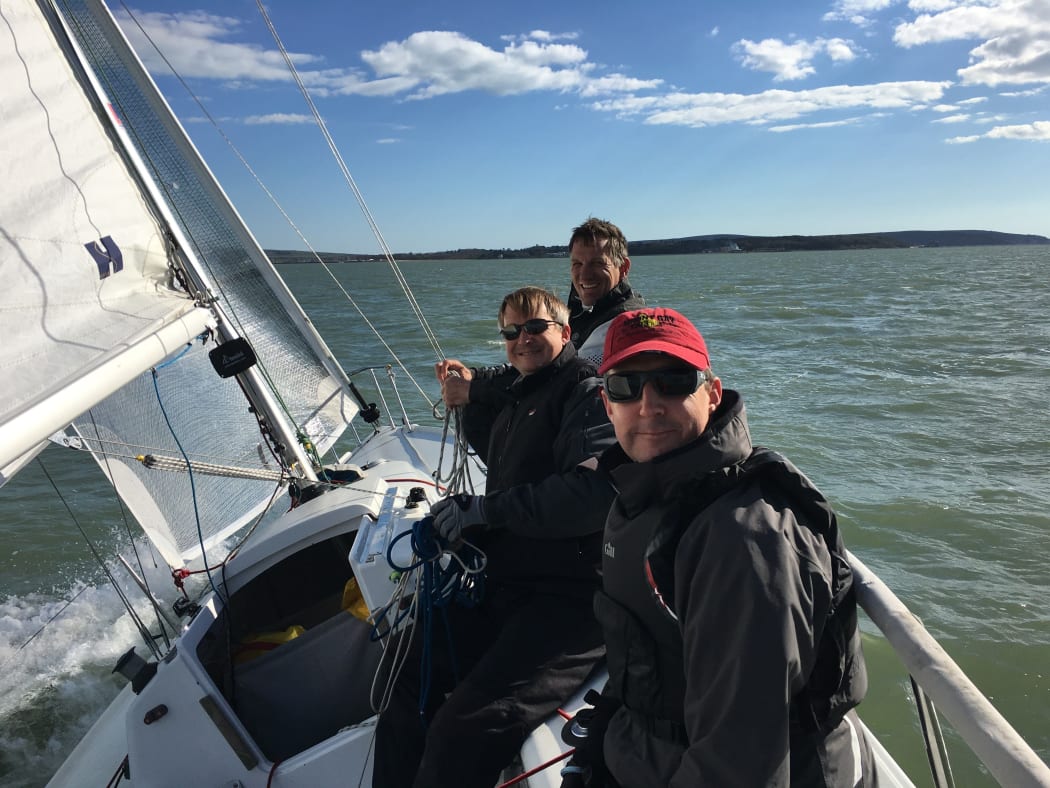 Ed Carrell and two friends sailing on the Solent