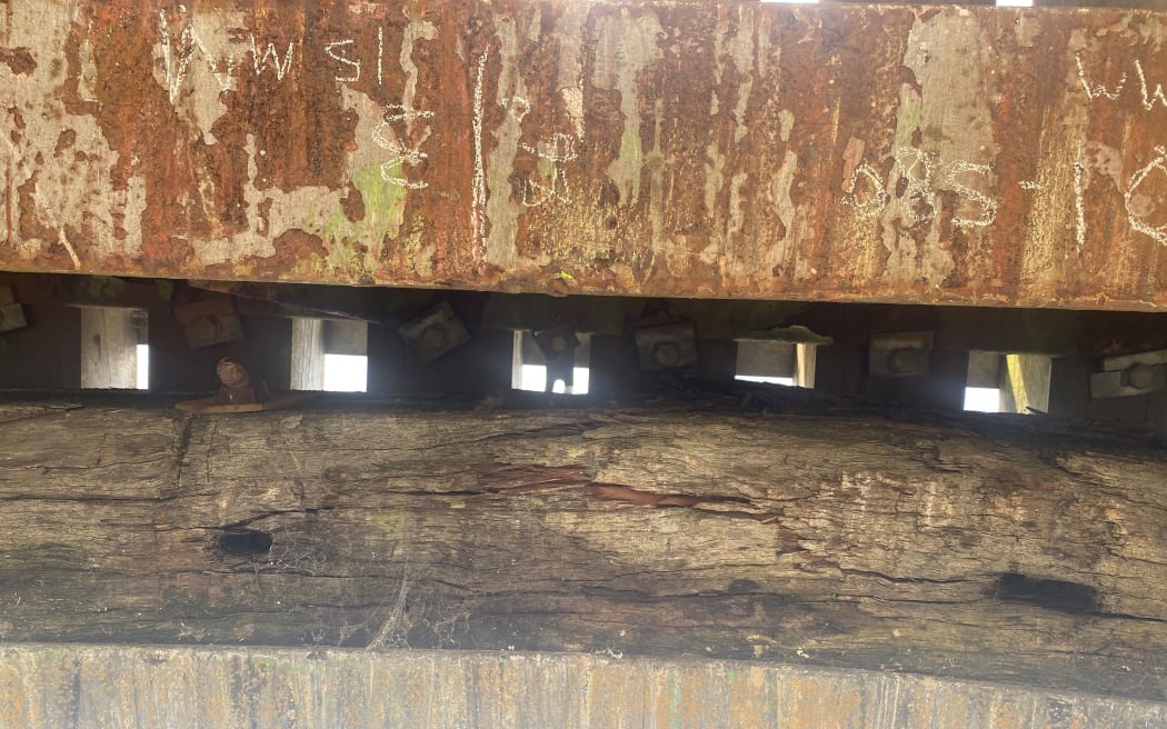 The cracking of the overhead impact beam needs to be replaced.