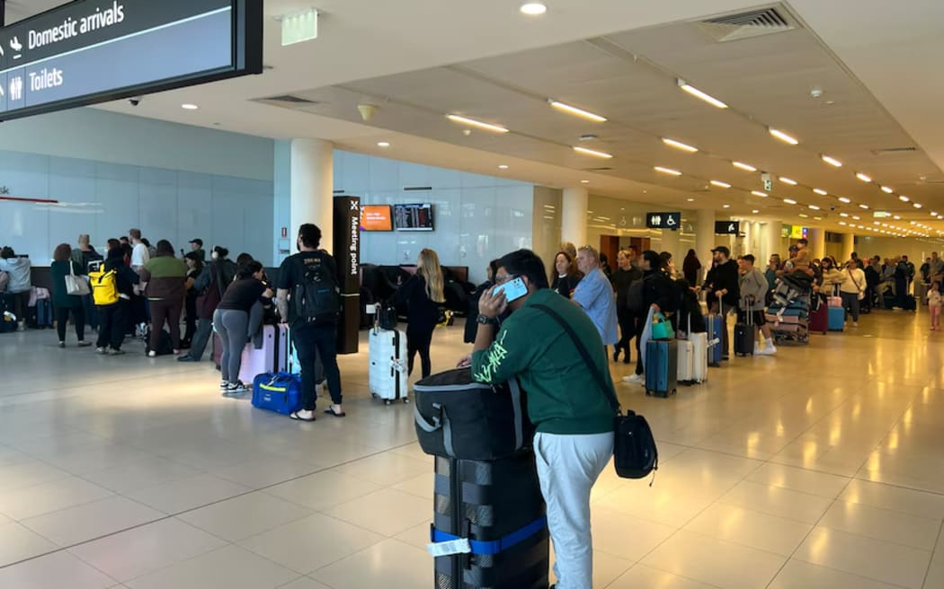 The queue for information about flights at Perth Airport stretched a long way, on 1 June 2024.