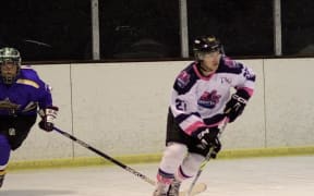 Two players in action playing ice hockey.