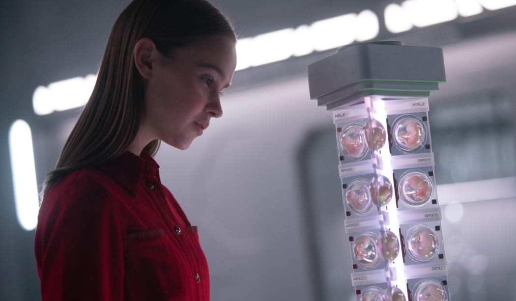 Clara Rugaard as Daughter, surveys her siblings in I Am Mother.