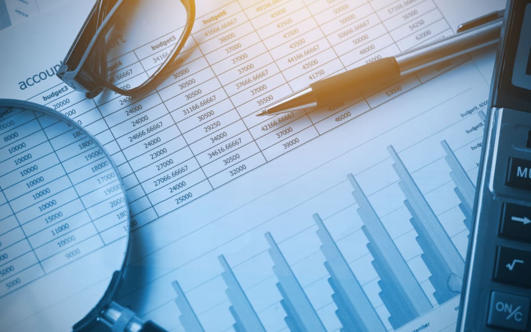 business documents accounting with calculator, pen, glasses and magnifying glass. concept for financial