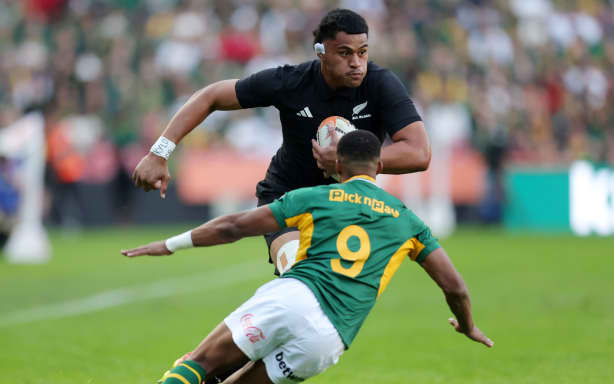 Tupou Vaa'i on the charge for the All Blacks.