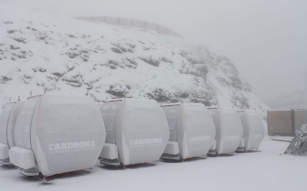 Cabins for a new Cardrona skifield gondola are covered in snow just two days after they arrived.