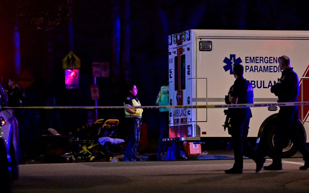 An ambulance is parked at the site of a street festival celebrating Filipino heritage in Vancouver, British Columbia, Canada, where a vehicle drove into a crowd