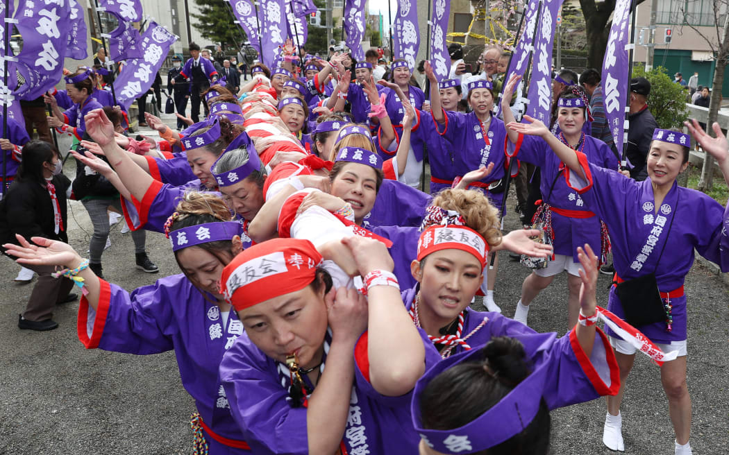 Women participate in a ritual event of naked festival for the first time at Owari Okunitama Shrine in Inazawa City, Aichi Prefecture on February 22, 2024. The unique Shinto festival, which have been held for 1250 years and had been participated by thousands of men wearing loincloths, was previously prohibited to women, but due to the diversification of values, approximately 100 women participate in one of Shinto rituals.( The Yomiuri Shimbun ) (Photo by Masanori Inagaki / Yomiuri / The Yomiuri Shimbun via AFP)