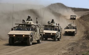 Israeli army training humvees equipped with mock cannon turrets drive during a drill in the Israeli-annexed Golan Heights, near Merom Golan on the border with Syria, on August 3, 2020.