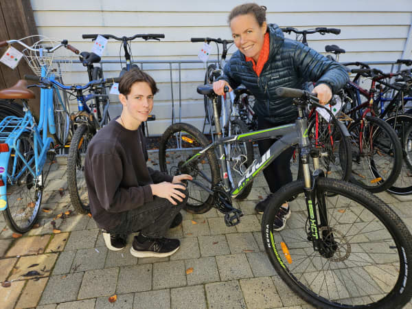 Jack Marsh and Emily Cambridge refurbish bikes to sell to students.