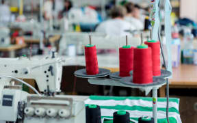 Fabric industry production line. Textile factory. Working tailoring process cloth. Modern equipment
