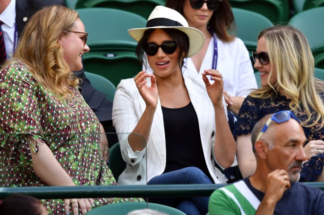 The Duchess of Sussex watches US player Serena Williams playing against Slovakia's Kaja Juvan during their women's singles second round match.