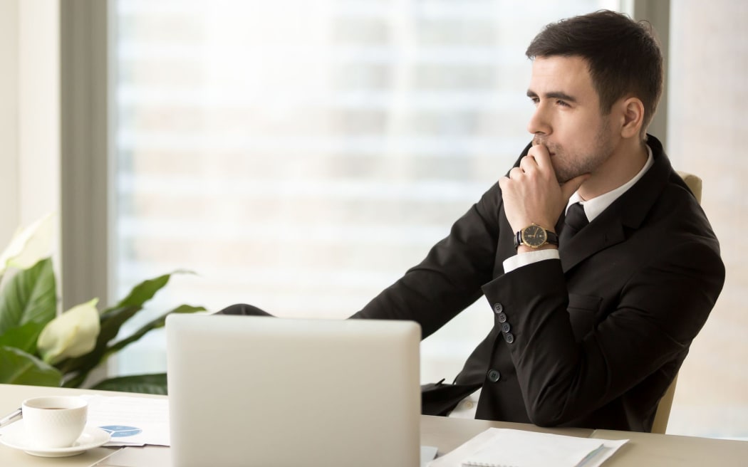 84439981 - thoughtful pensive businessman deep in thoughts looking away sitting near laptop at workplace, successful entrepreneur thinking over new ways to improve business, future perspectives, managing risks