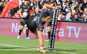 New Zealand winger Dallin Watene-Zelezniak scores his try.