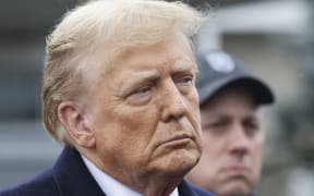 Former President Donald Trump stands silently after giving a brief statement after attending the wake for slain NYPD Officer Jonathan Diller at the Massapequa Funeral Home on 28 March, 2024 in Massapequa, New York. Officer Diller was killed on March 25th when he was shot in Queens after approaching an illegally parked vehicle. Two suspects have been arrested and charged, and are being held without bail for the killing.