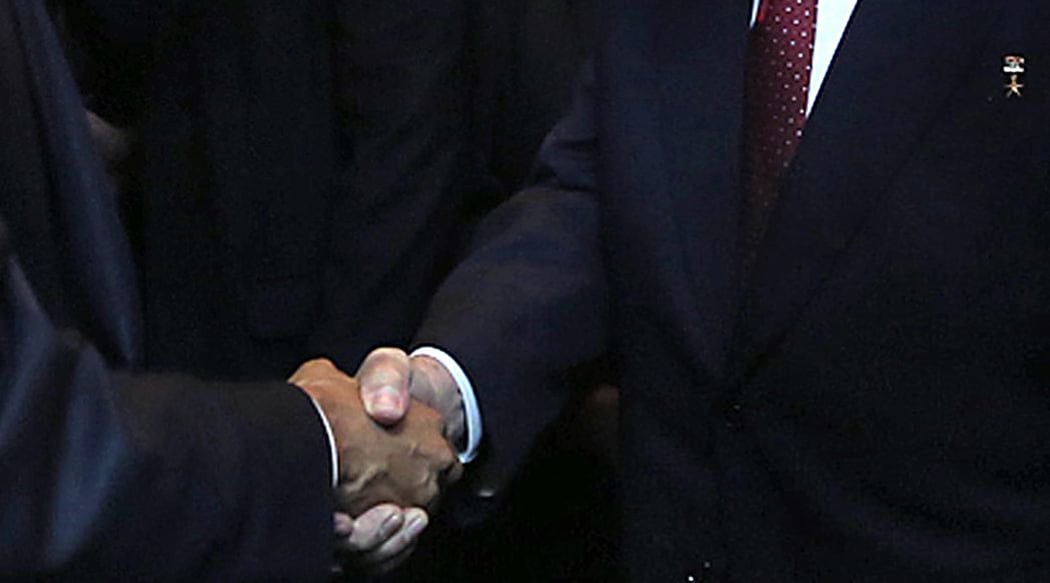 The United States and Cuban presidents shake hands at the 7th 
Americas Summit in Panama City