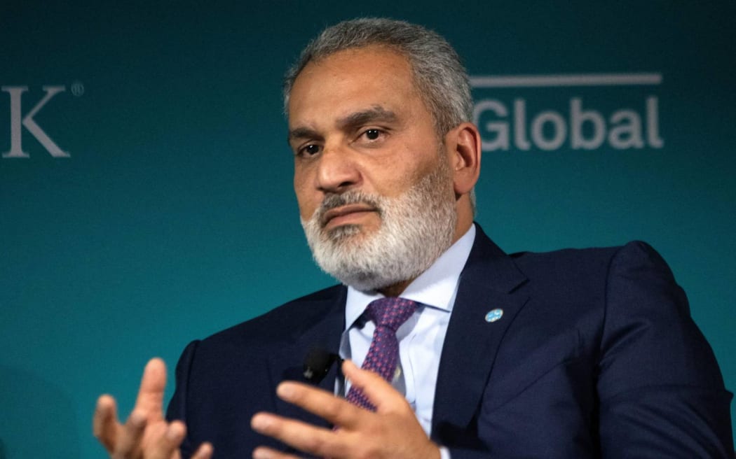 Haitham al-Ghais, Secretary General of OPEC, speaks with Carlos Pascual during CERAWeek by S&P Global in Houston, Texas on March 7, 2023. (Photo by Mark Felix / AFP)