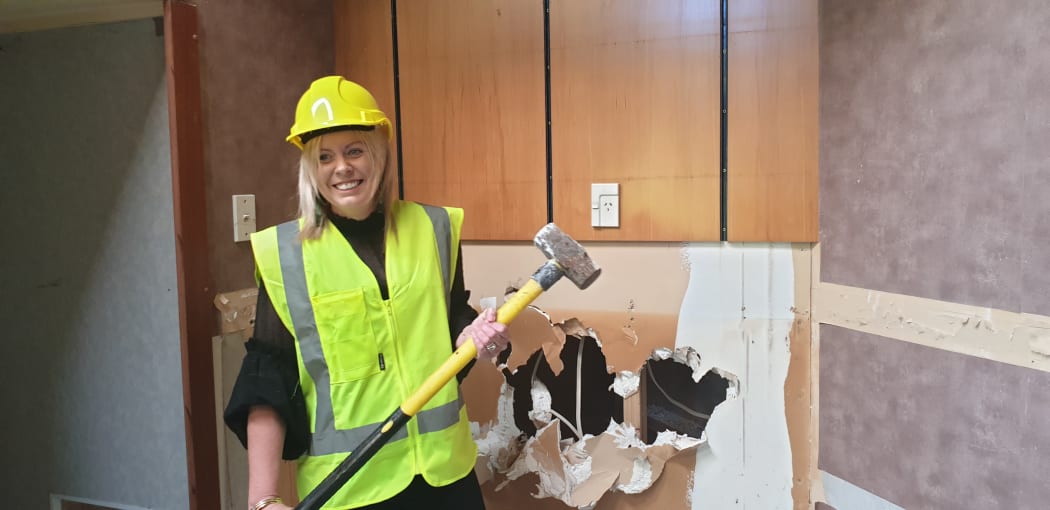Melissa Vining was the first to strike the sledgehammer.