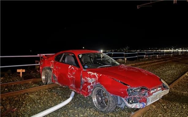 The vehicle from one of the gatherings that crashed through a metal barrier onto railways off State Highway 2.