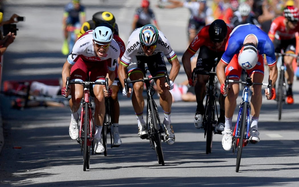 Peter Sagan (centre) leaves Mark Cavendish sprawling in the Tour de France
