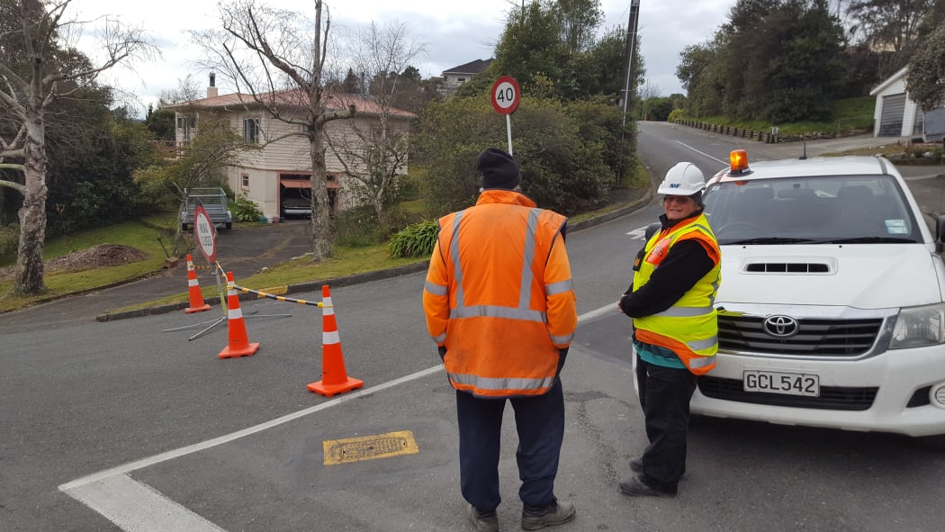 Contractors guard a police cordon in Jenner Rd, Nelson.