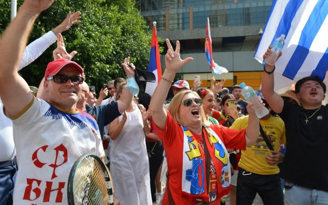 MELBOURNE, AUSTRALIA - JANUARY 10: People celebrate after Australian court quashes visa cancellation for Novak Djokovic on January 10, 2022 in Melbourne, Australia.