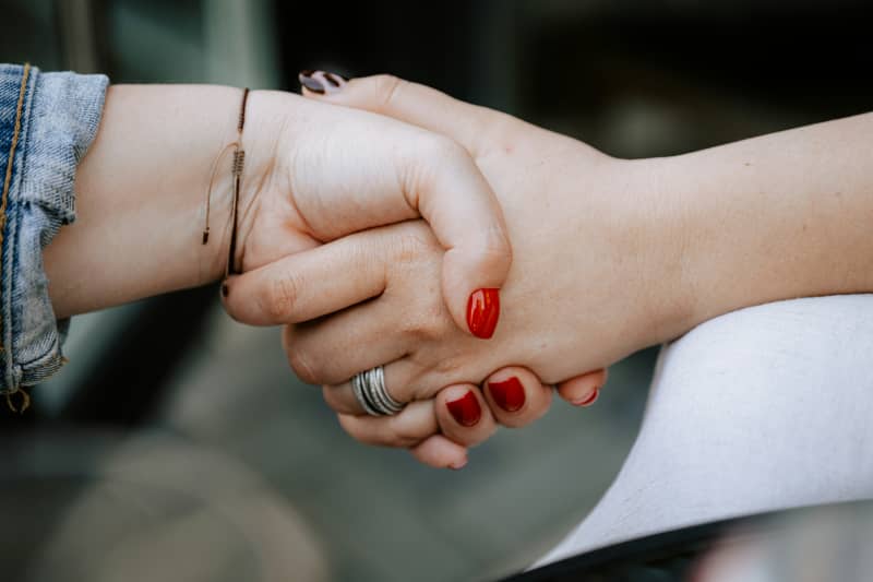 Close-up of two hands shaking.