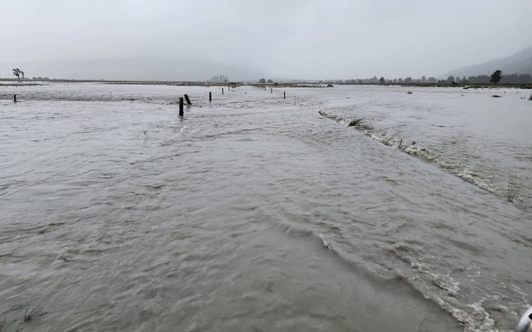 Hari Hari farmer Bernard Walkington awoke this morning to the "devastating" sight of the Wanganui River floodwaters flowing across his farmland, here looking north-west towards Lake Ianthe.