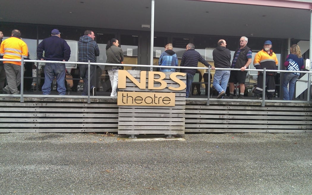 Mine workers gathering for the meeting on Friday.