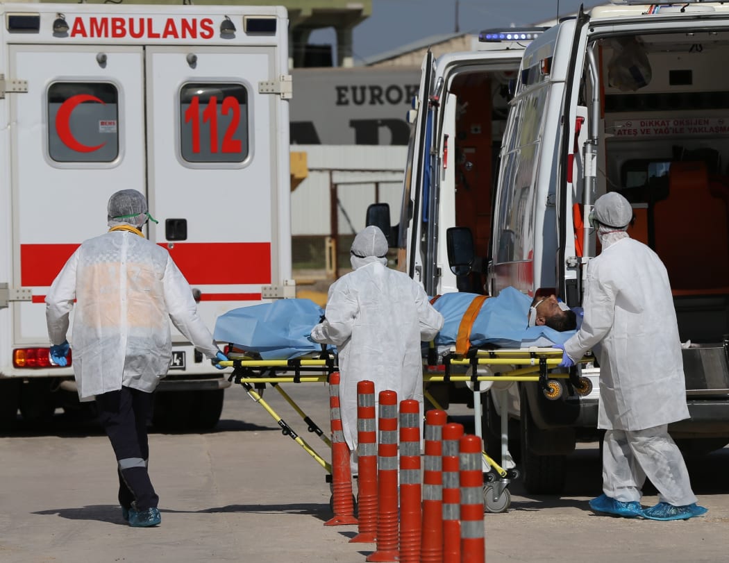 An injured man is being brought to Reyhanli State Hospital in Hatay, Turkey on 4 April, 2017.