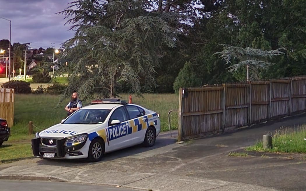 Police block an alleyway in Massey, West Auckland