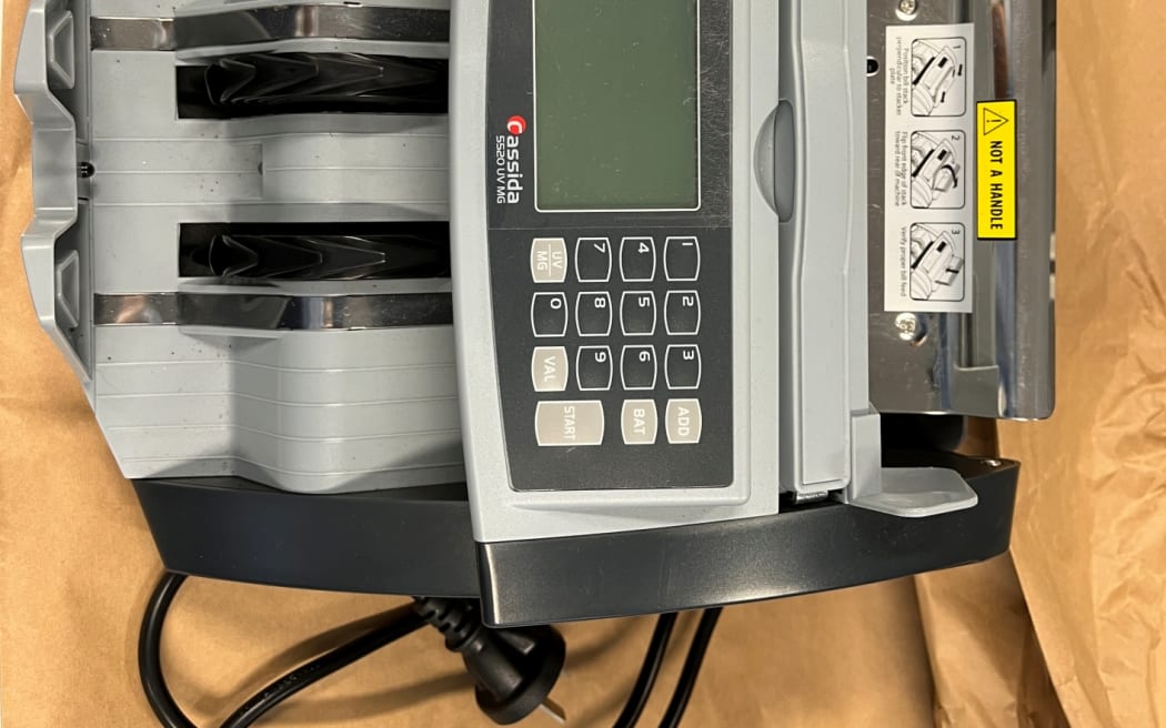 A cash counting machine that was seized by police during Operation Munich.