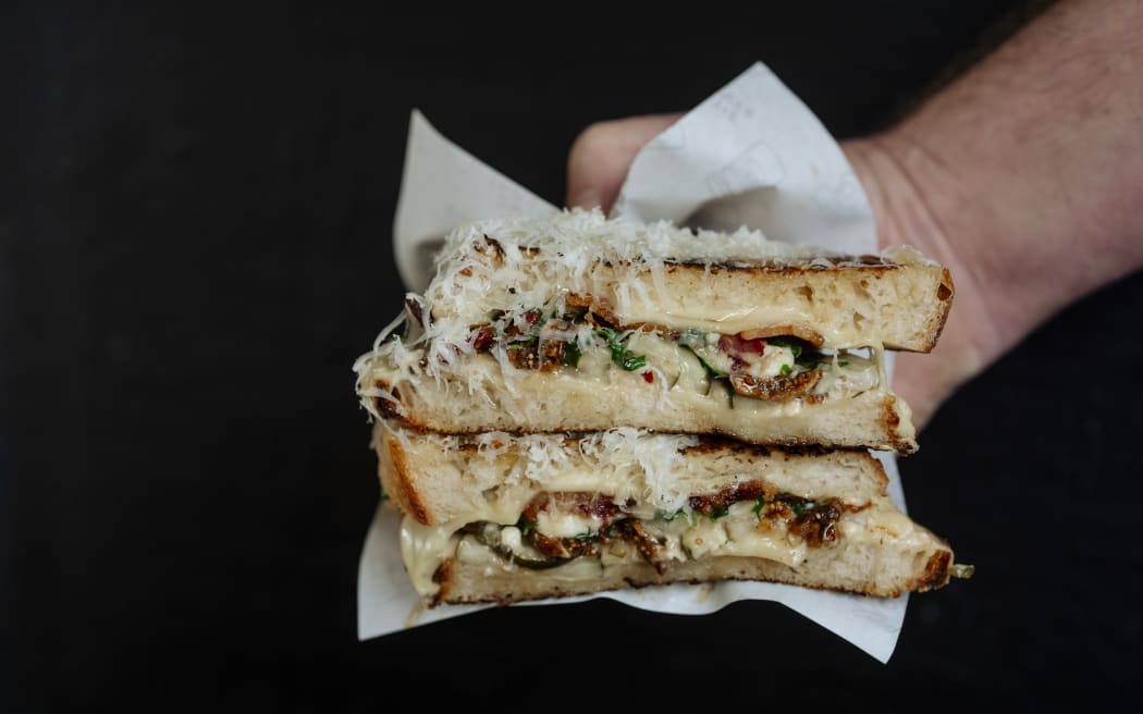 'Figgy in the Middle' is a cheeseboard in a sandwich - it features Swiss cheese, blue cheese, parmesan, and sliced figs.