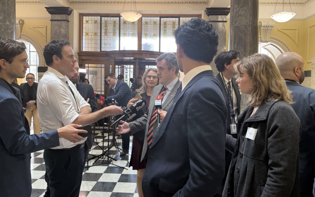 Chris Bishop being questioned by journalists before heading into question time. Photo: Davina Zimmer
