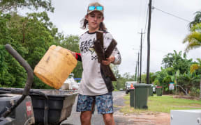 Mason Dingwall, 15, is colleting rubbish from flood-affected homes. (ABC Far North: Christopher Testa)